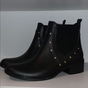 Black Kate spade booties with gold stud accents